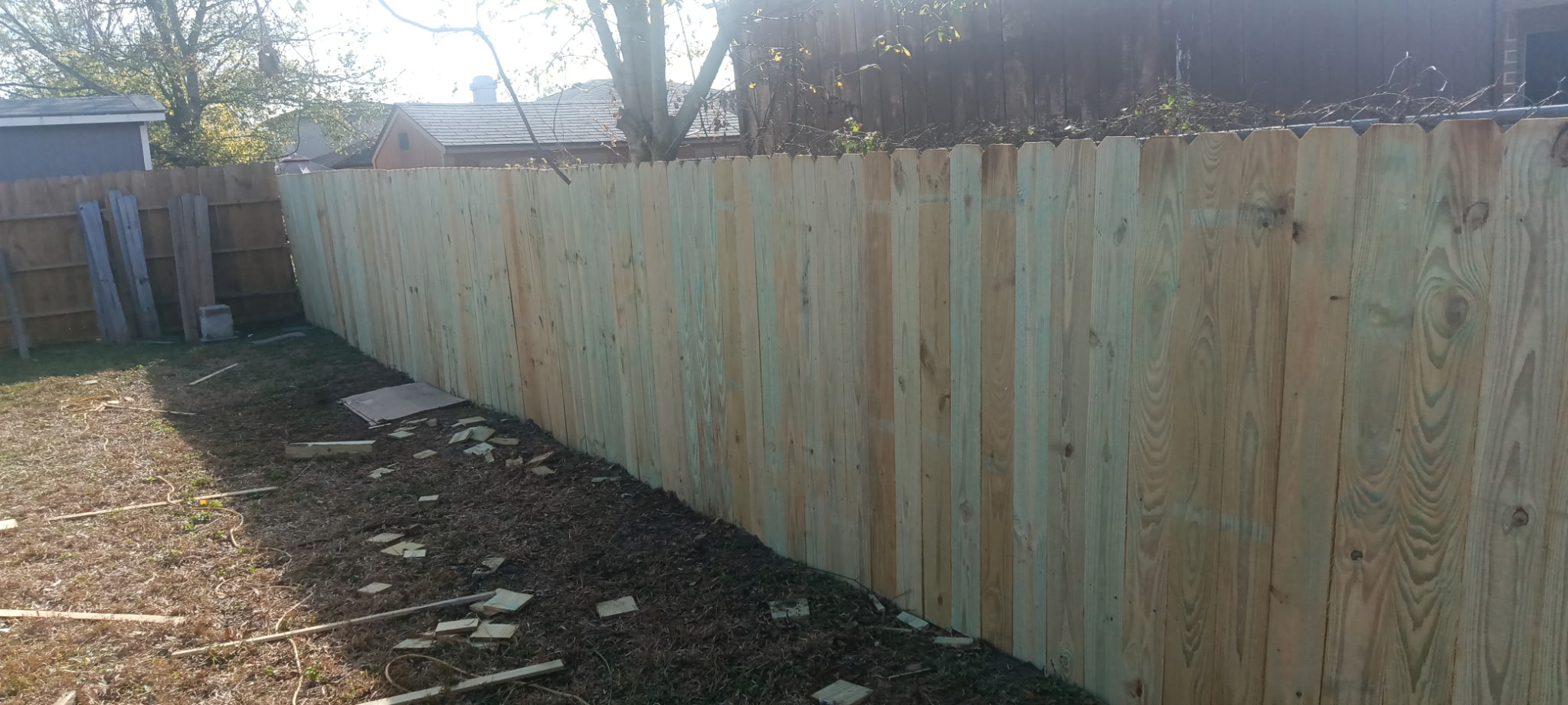Long run of newly installed cedar privacy fence