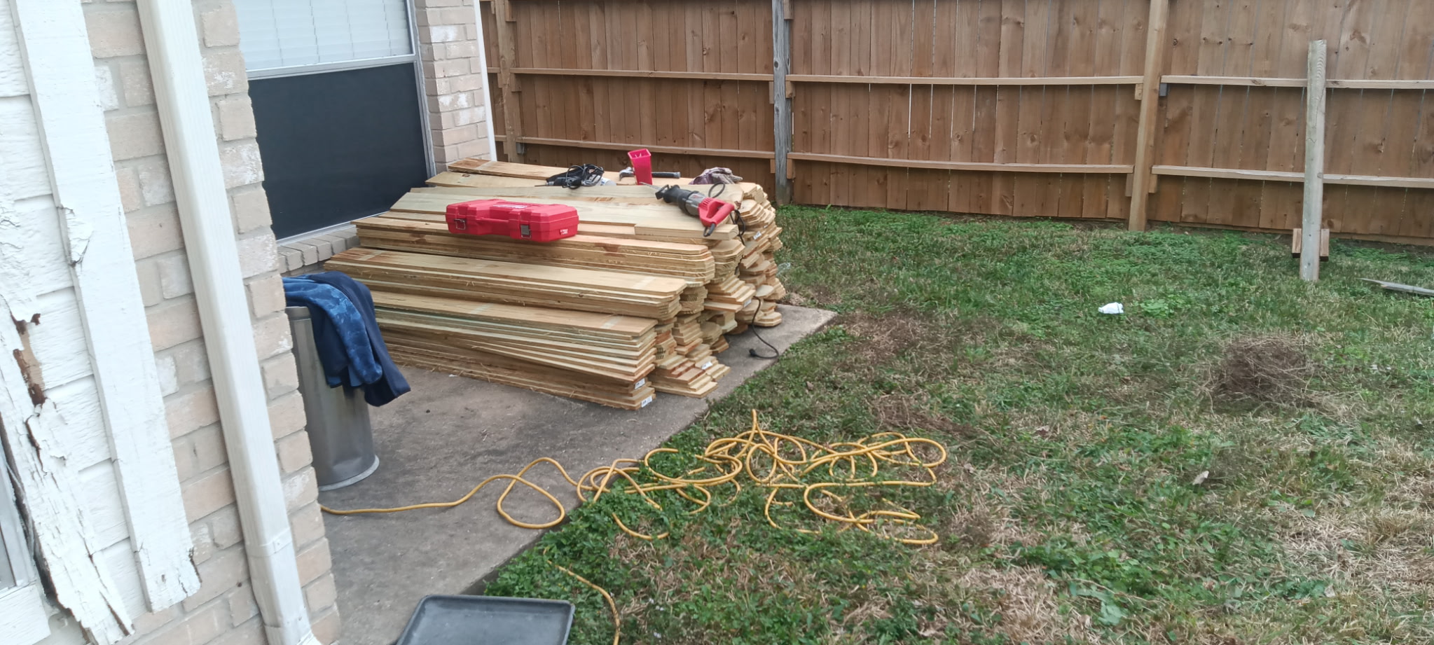 Organized building materials and tools prepared for a residential project